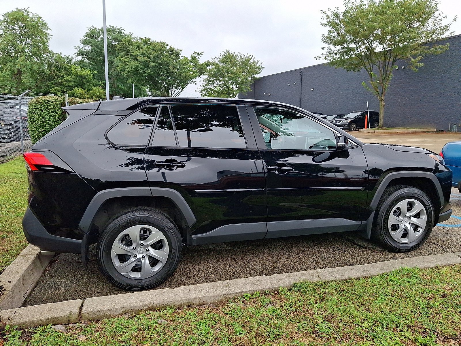 Used 2023 Midnight Black Metallic Toyota LE image 1