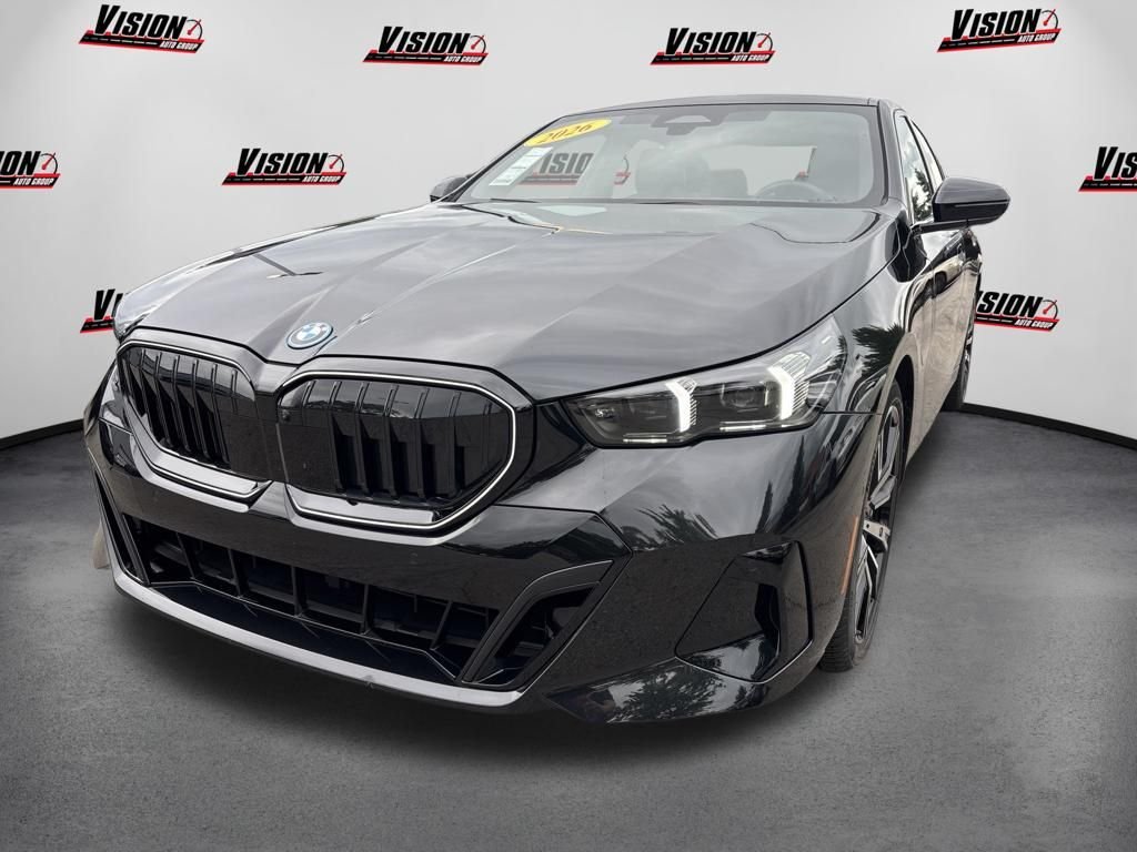 Used 2026 Black BMW 550e xDrive image 1