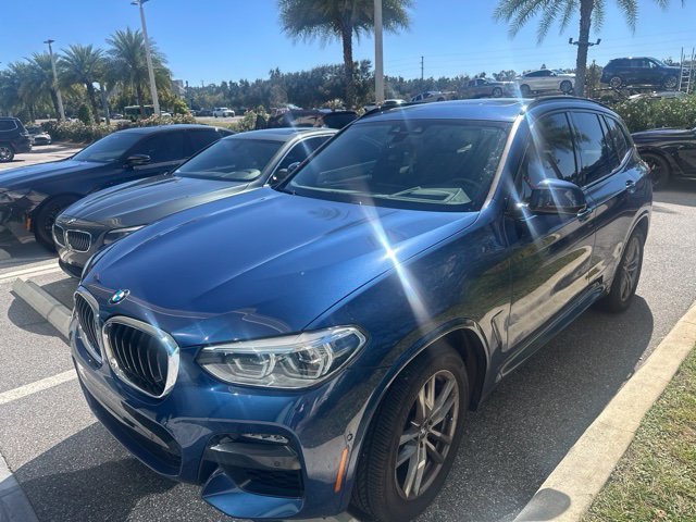 Used 2021 Blue Metallic BMW sDrive30i image 1