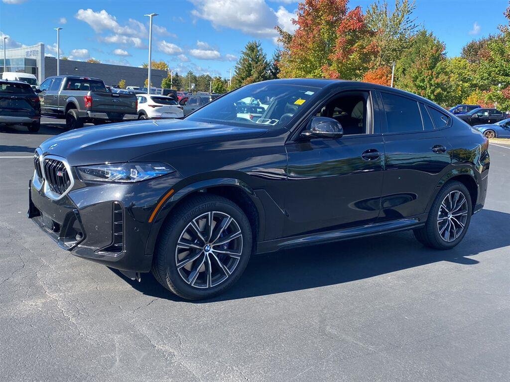 Used 2026 Black Sapphire Metallic BMW M60i image 7