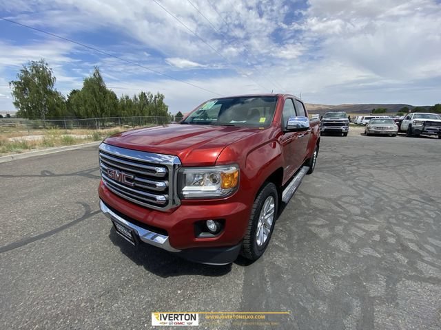 Used 2016 COPPER RED METALLIC GMC 4WD SLT image 1