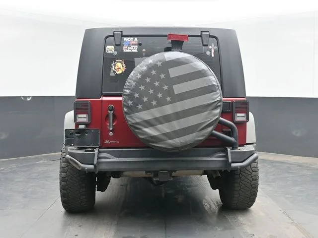 Used 2012 Red Jeep Unlimited Sport image 8