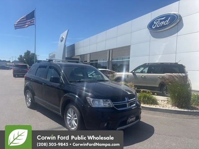 Used 2015 Black Dodge SXT image 1