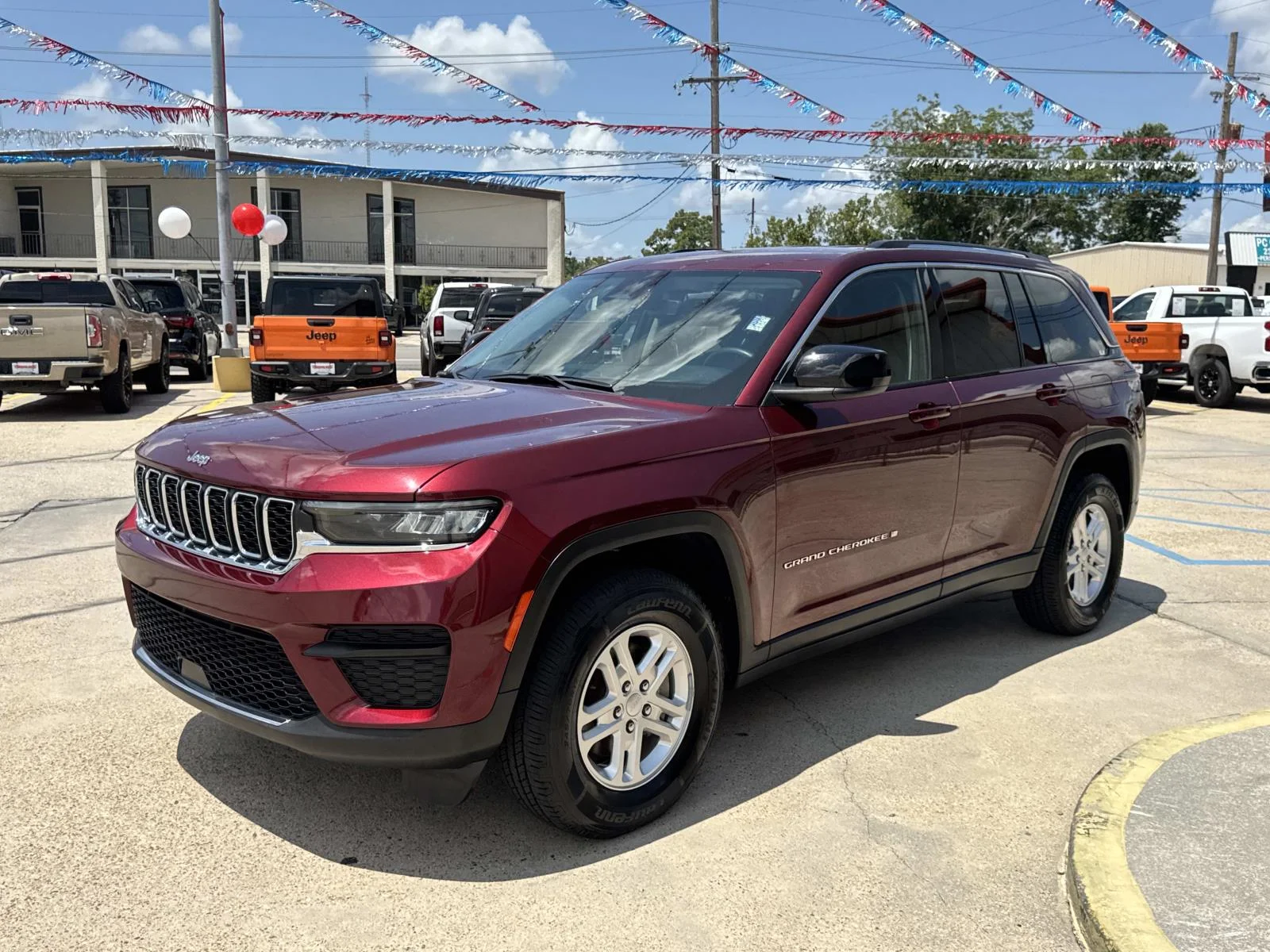 Used 2024 Velvet Red Pearlcoat Jeep Laredo image 3