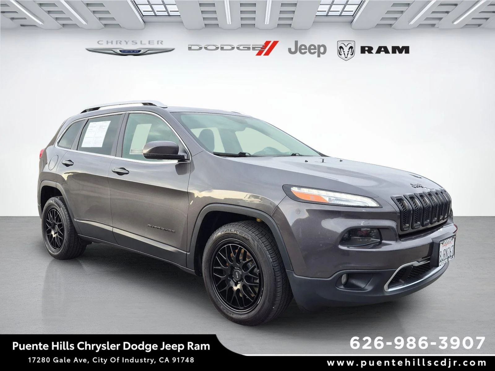Used 2016 Granite Crystal Metallic Clearcoat Jeep Limited image 1