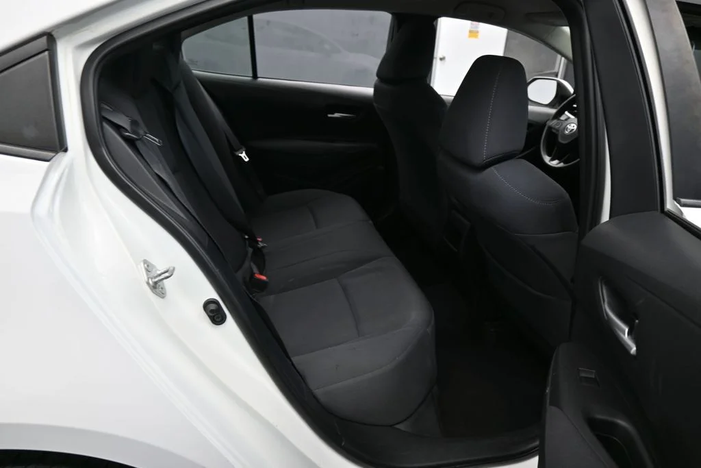 Used 2021 Super White Toyota LE image 28