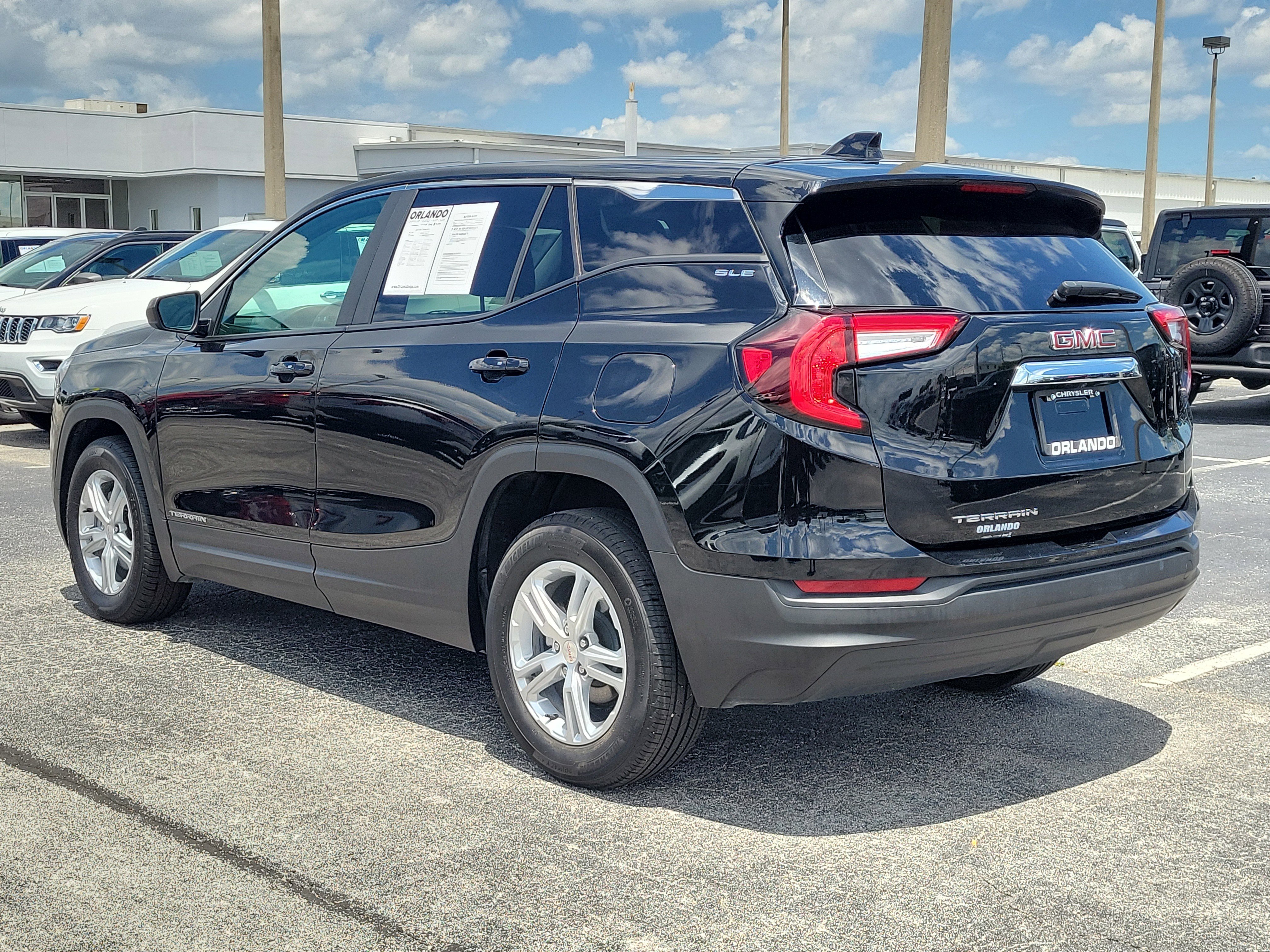 Used 2024 Ebony Twilight Metallic GMC SLE image 4