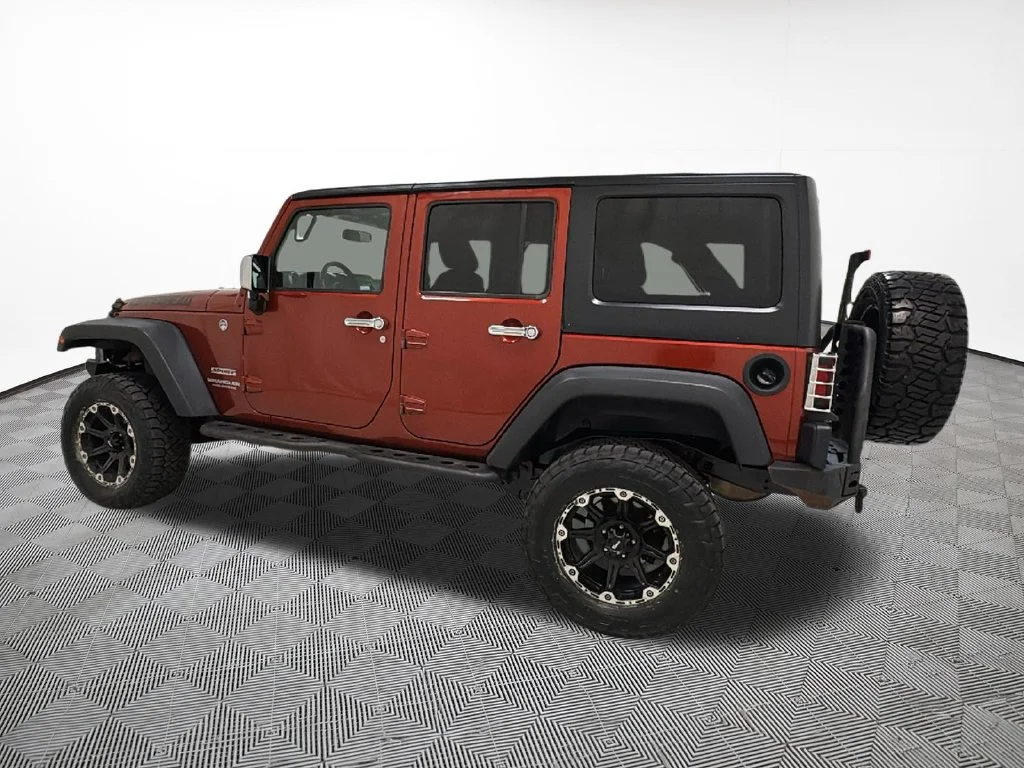 Used 2014 Orange Jeep Unlimited Sport image 12
