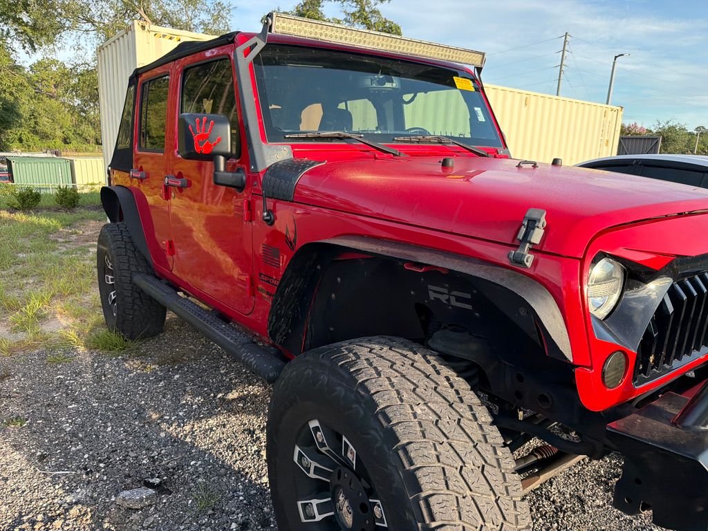 Used 2015 Red Jeep Unlimited Sport image 4