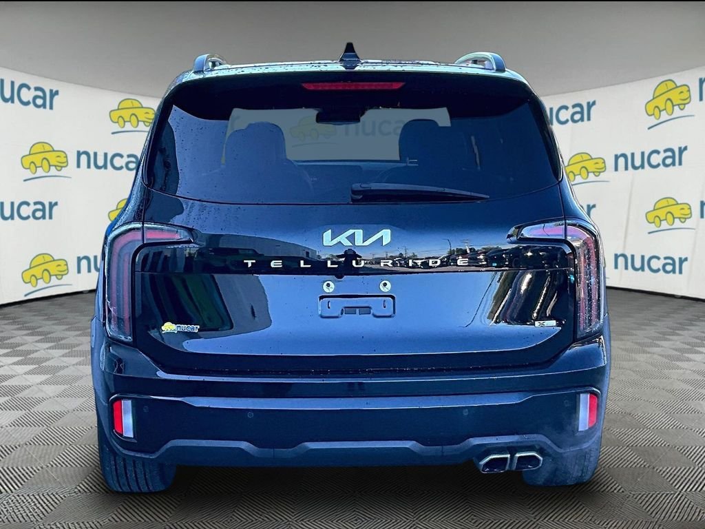 Used 2024 Ebony Black Kia EX X-Line image 5