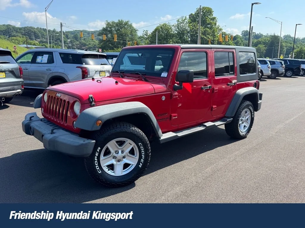 Used 2014 Red Jeep Unlimited Sport image 1
