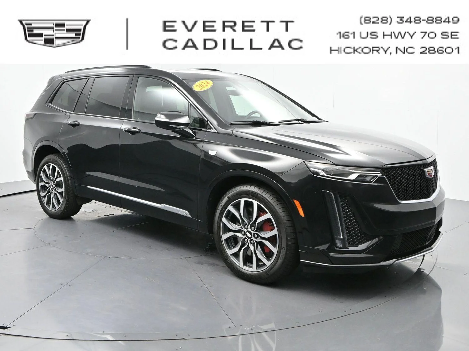 Used 2024 Stellar Black Metallic Cadillac Sport image 1