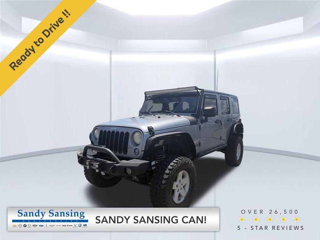 Used 2014 Billet Metallic Clearcoat Jeep Unlimited Sahara image 1