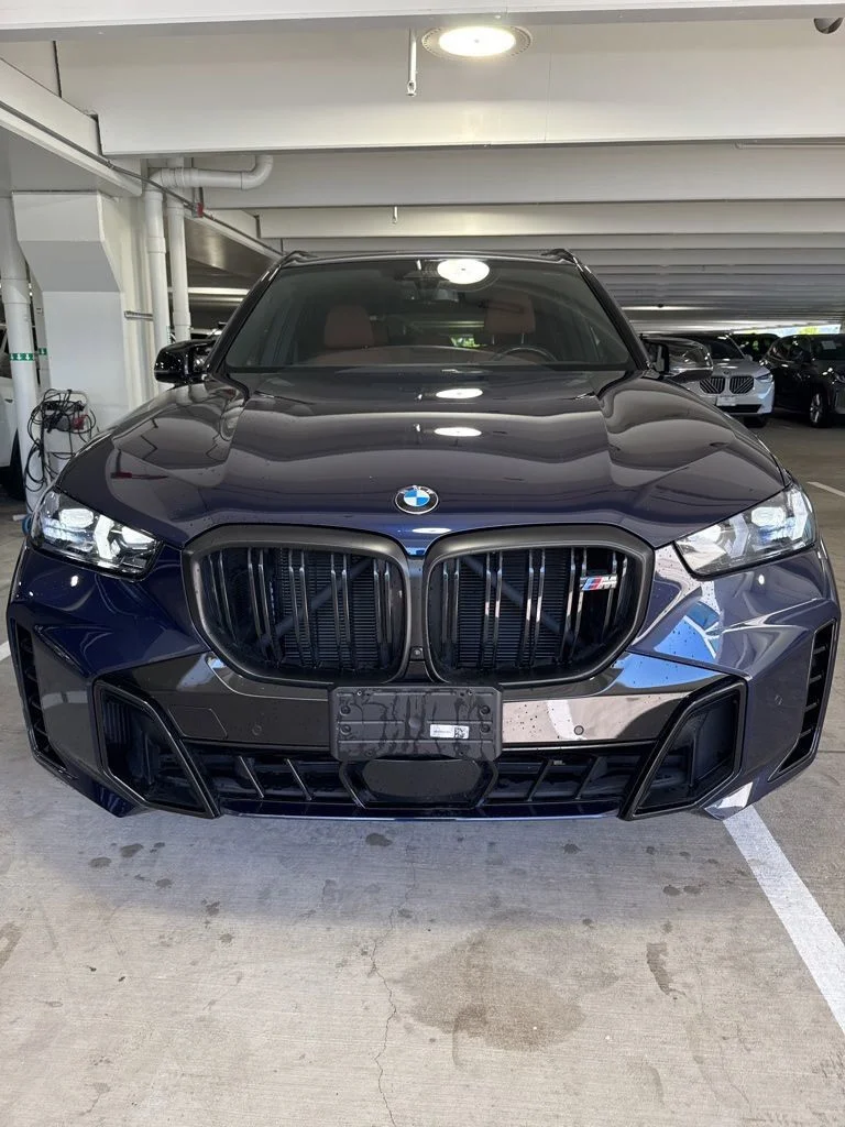 Used 2024 Tanzanite Blue II Metallic BMW M60i image 2