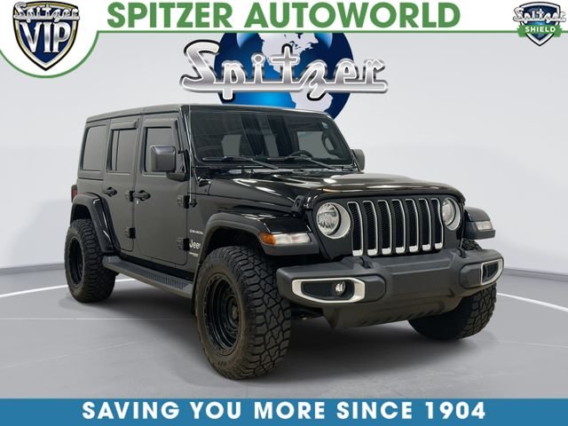 Used 2020 Black Jeep Unlimited Sahara image 1