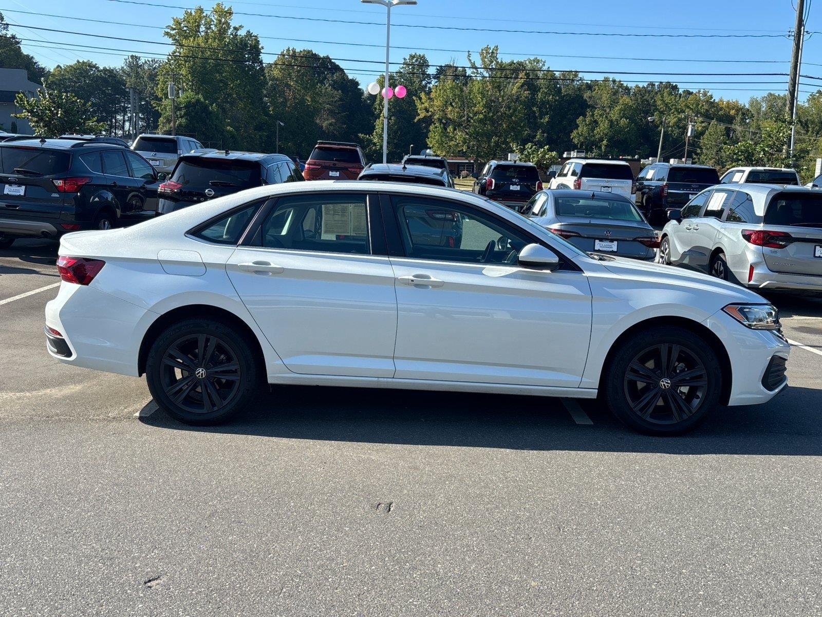 Used 2023 Opal White Pearl Volkswagen SE image 6