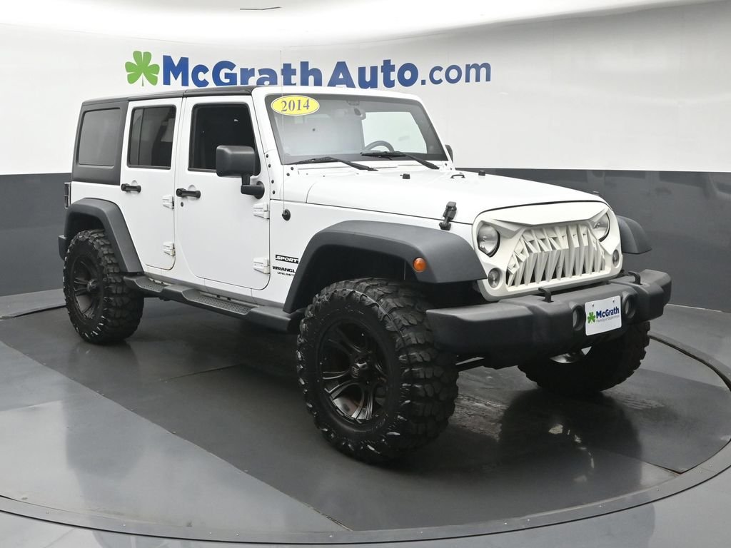 Used 2014 White Jeep Unlimited Sport image 2
