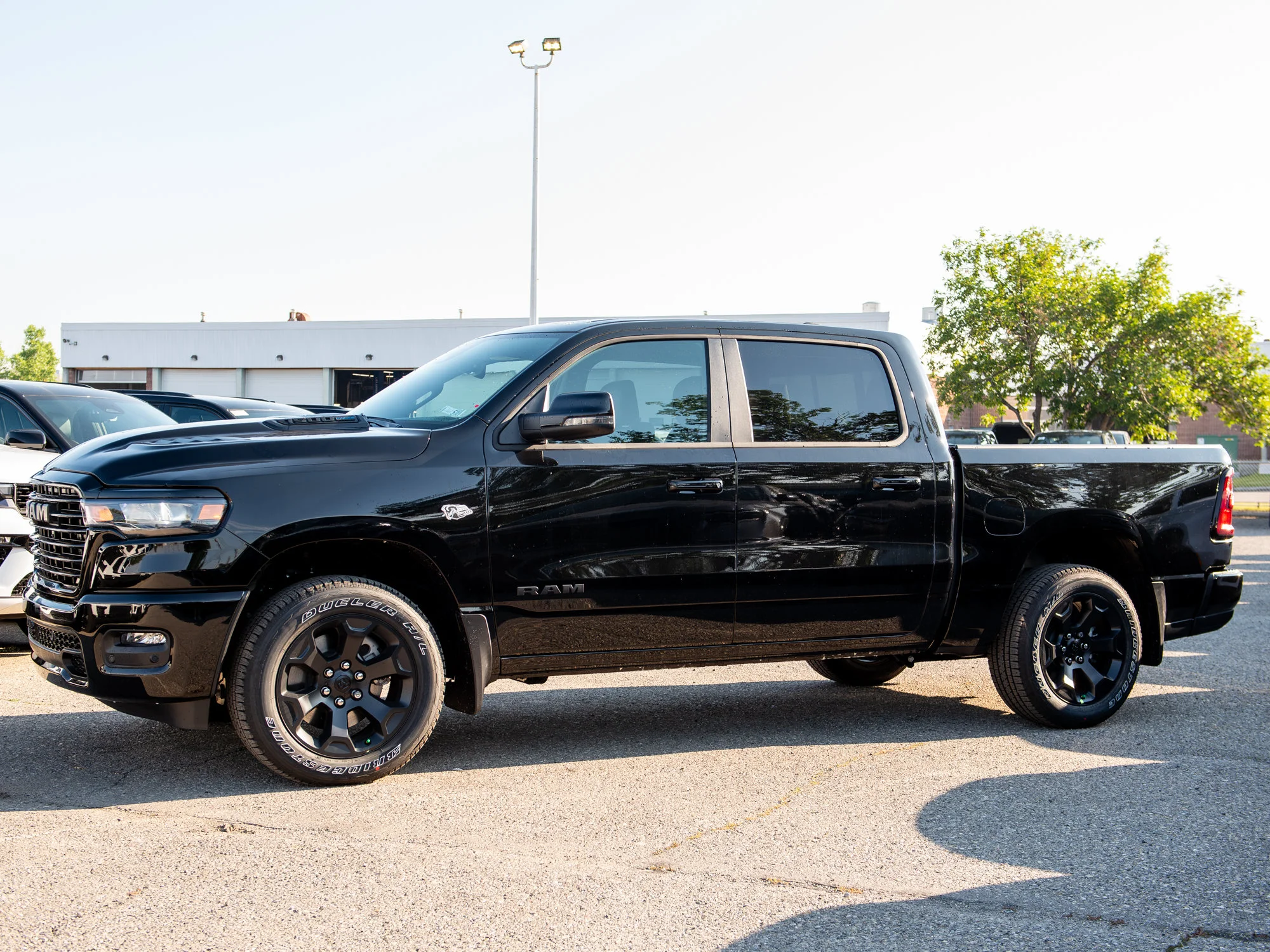 New 2026 Black RAM Sport* Crew Cab 4x4, Pano Sunroof, 3.92 Rear Axle, Passive Cold End Exhaust image 2