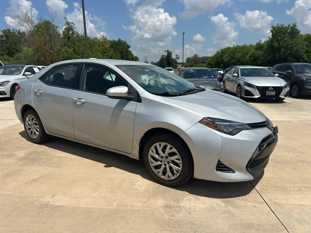 Used 2019 Classic Silver Metallic Toyota LE image 2