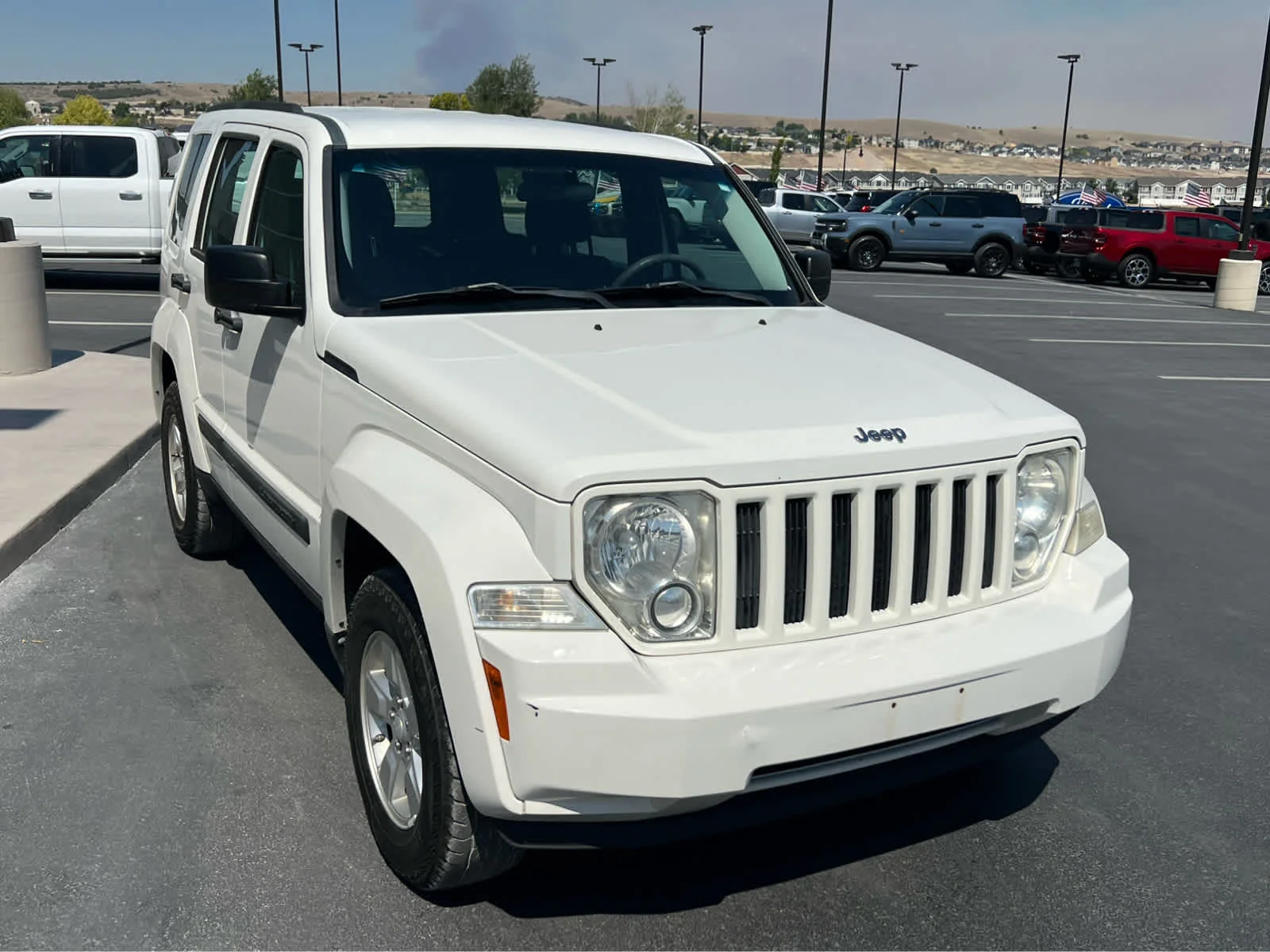 Used 2010 Stone White Clearcoat Jeep Sport image 4