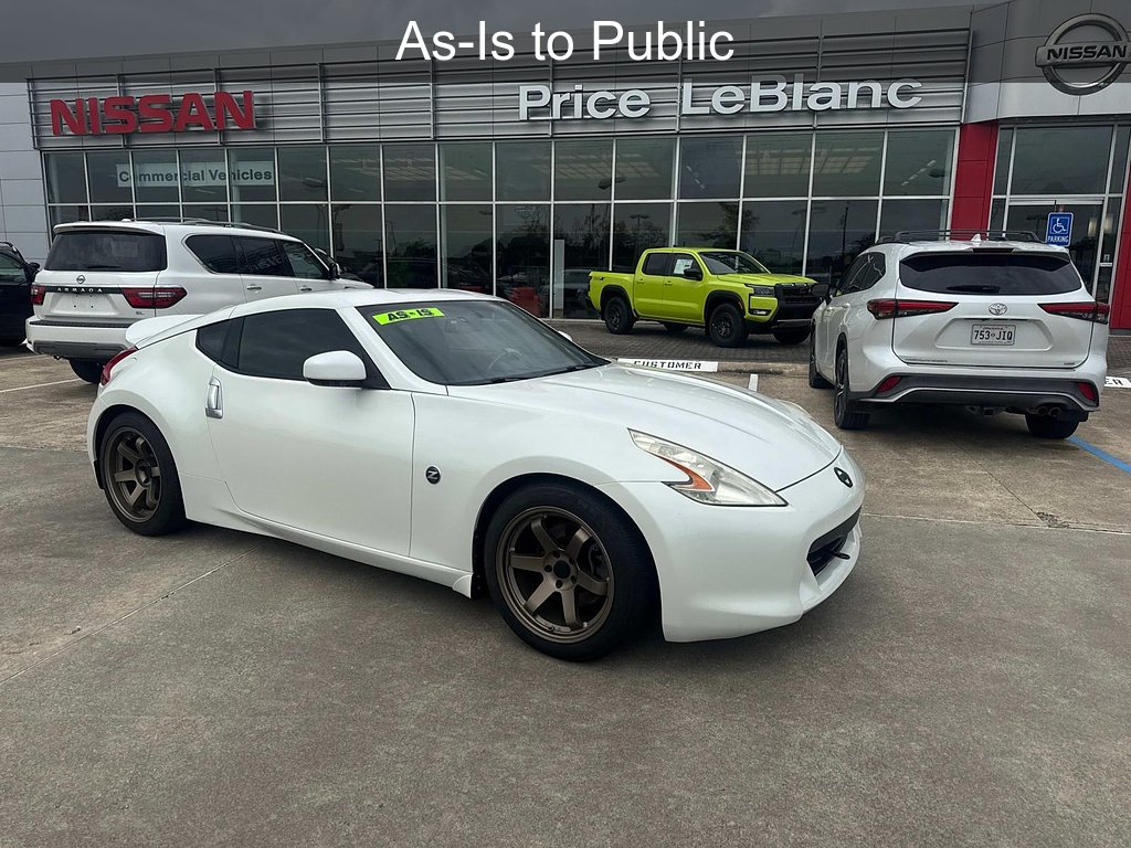 Used 2010 Pearl White Nissan Touring image 1