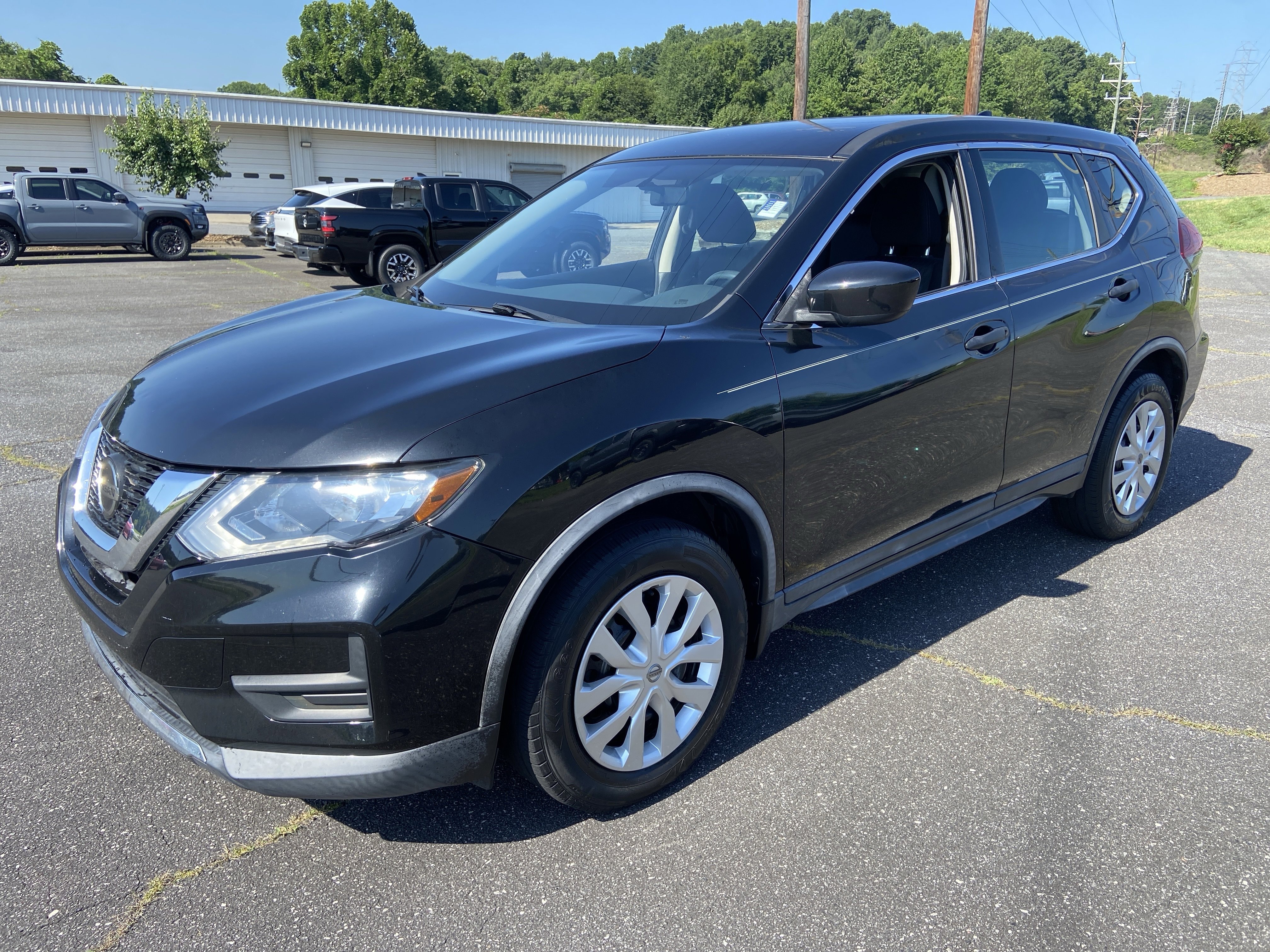 Used 2018 Magnetic Black Nissan S image 1