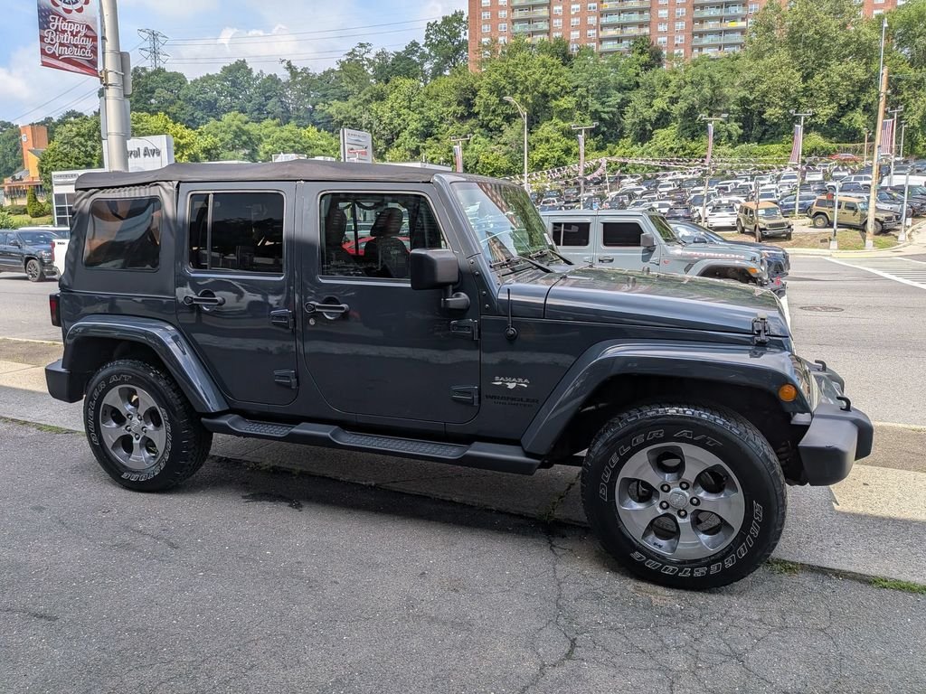 Used 2016 Black Jeep Unlimited Sahara image 5