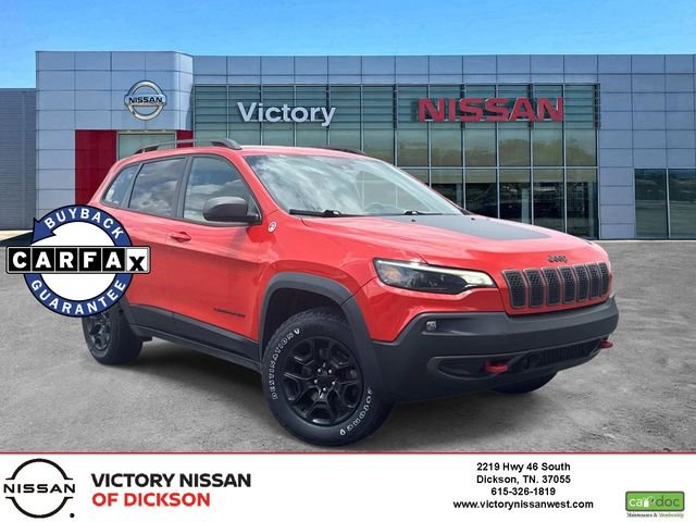 Used 2021 Orange Jeep Trailhawk image 1