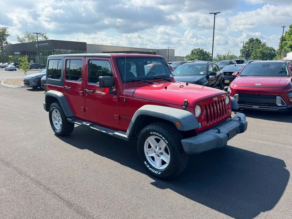 Used 2014 Red Jeep Unlimited Sport image 2