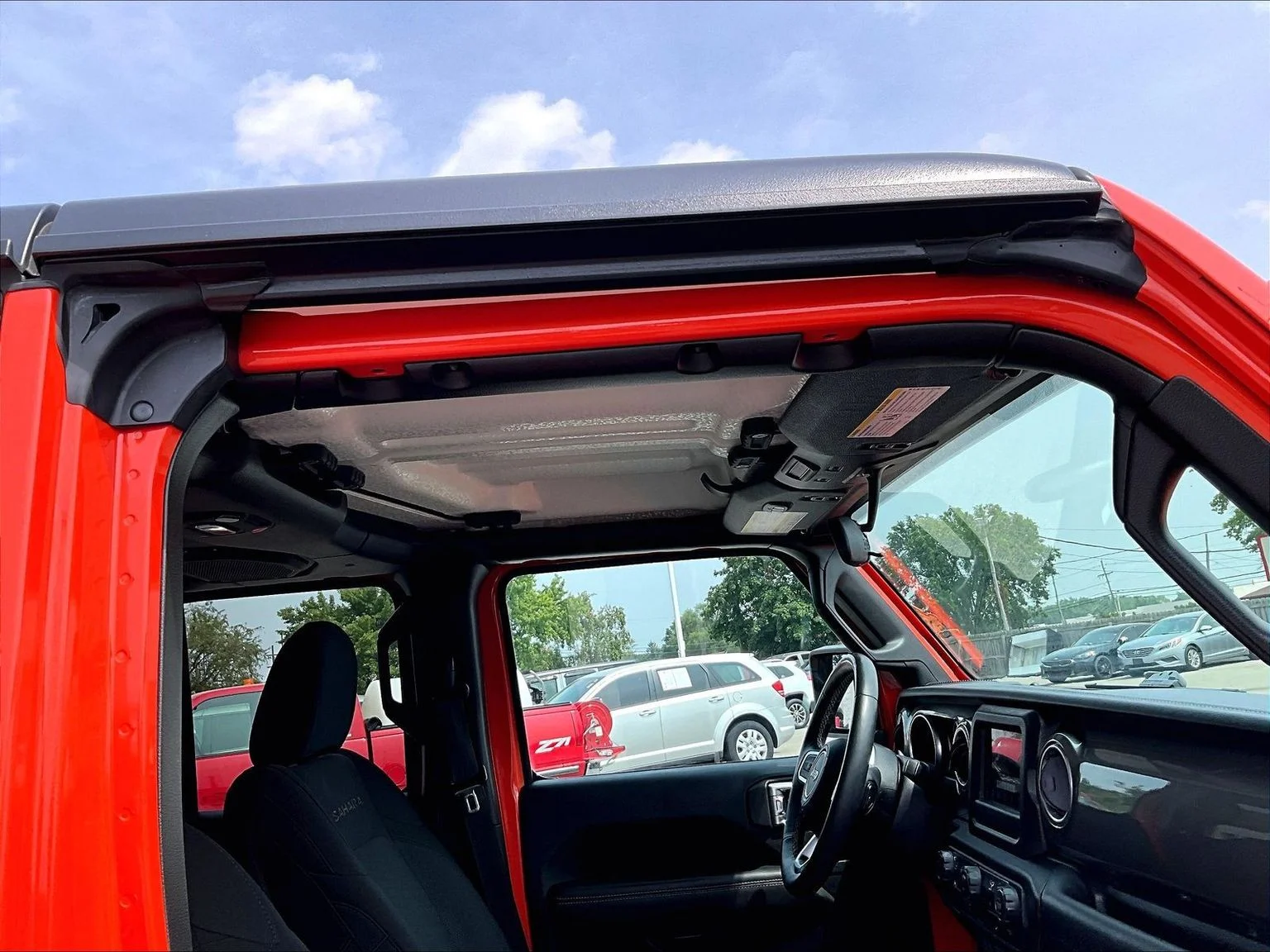 Used 2018 Orange Jeep Unlimited Sahara image 23