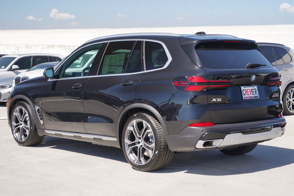 New 2026 Black Sapphire Metallic BMW xDrive50e image 11