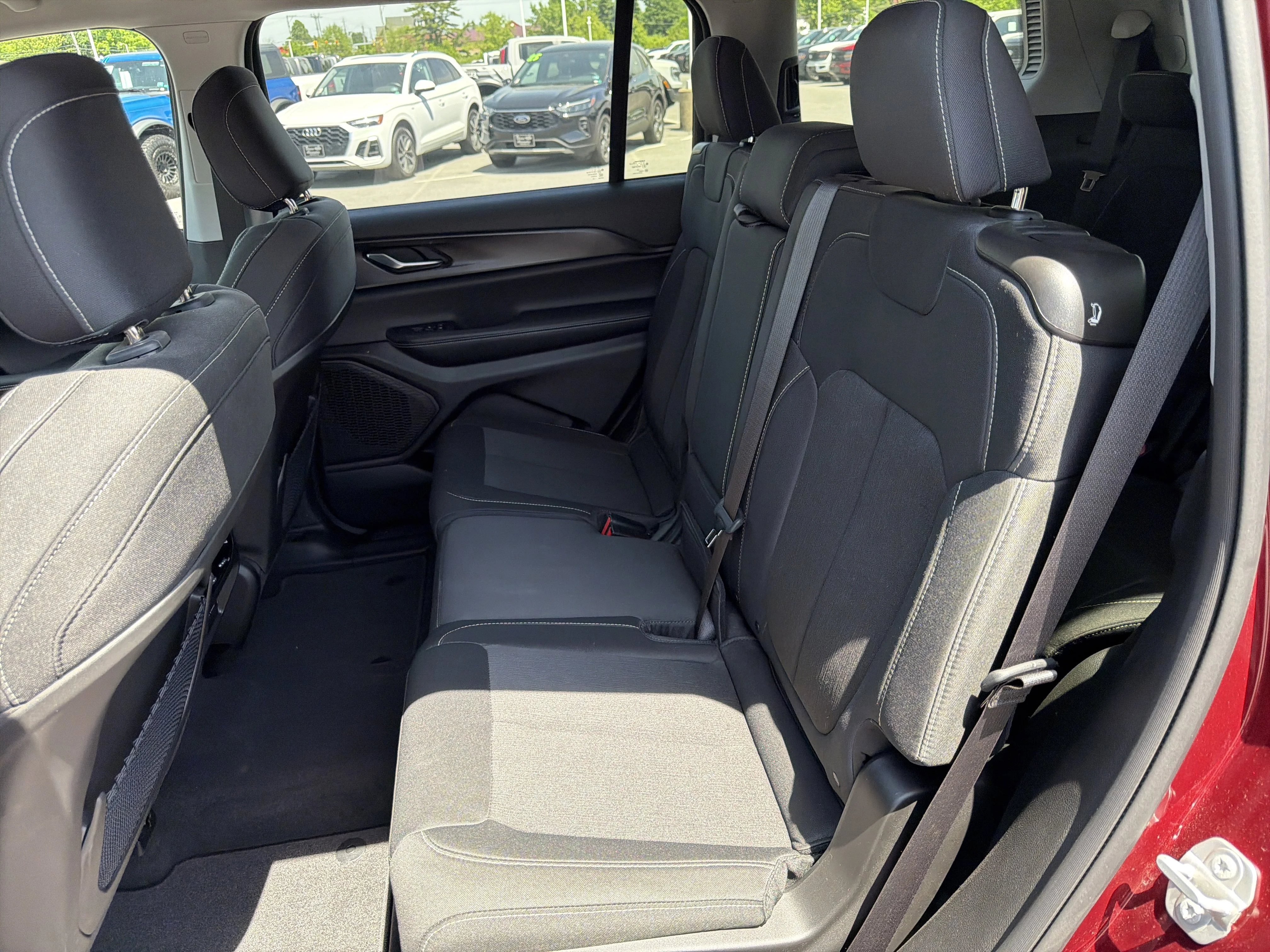 Used 2023 Velvet Red Pearlcoat Jeep Laredo image 13