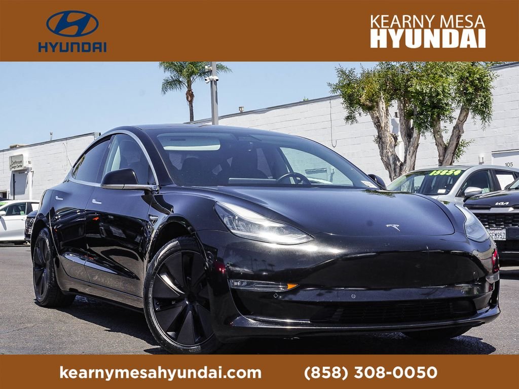 Used 2019 Solid Black Tesla Standard Range Plus image 1