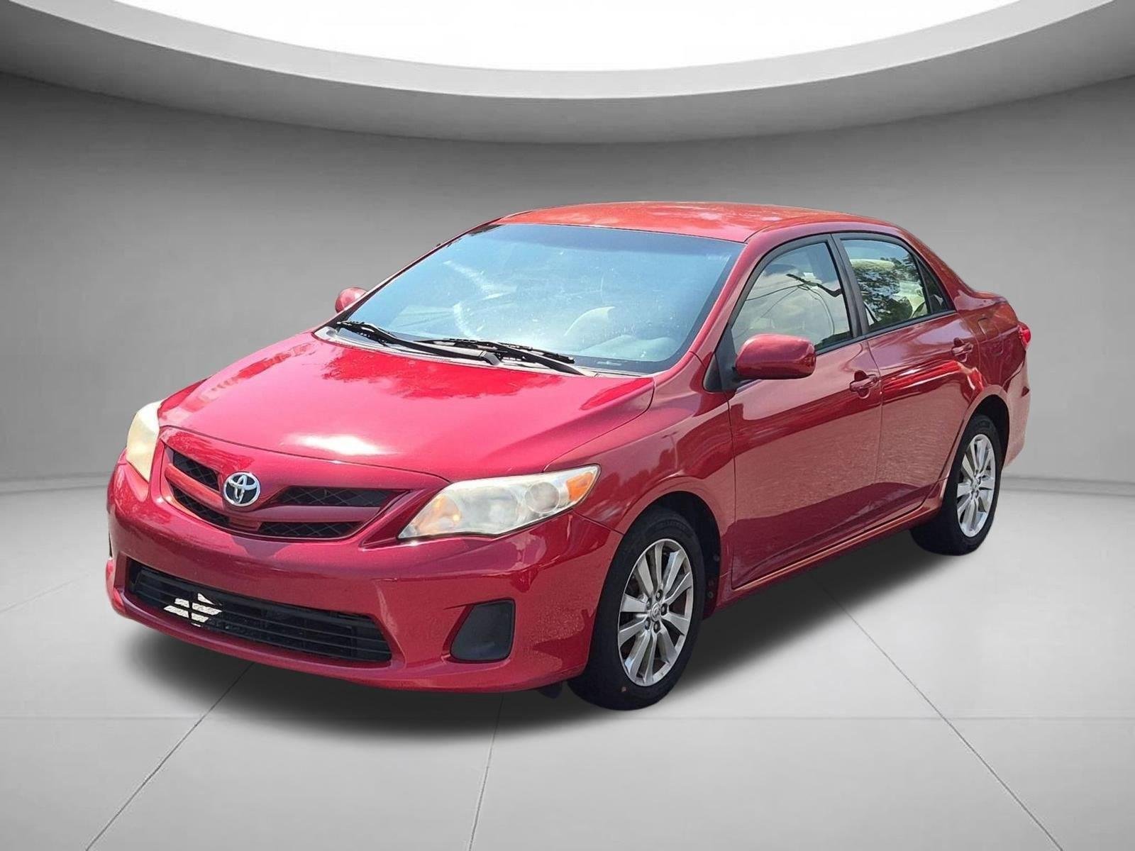 Used 2011 Barcelona Red Metallic Toyota LE image 1