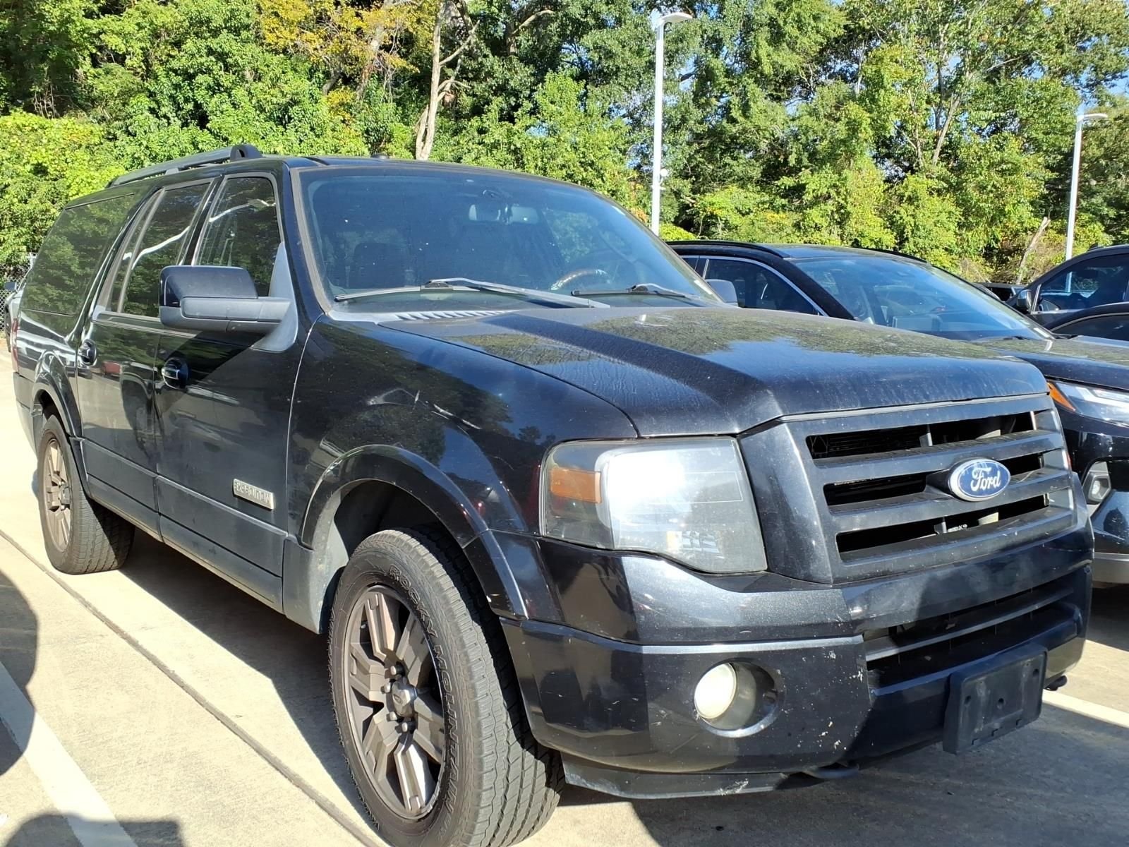 Used 2010 Tuxedo Black Metallic Ford Limited image 1