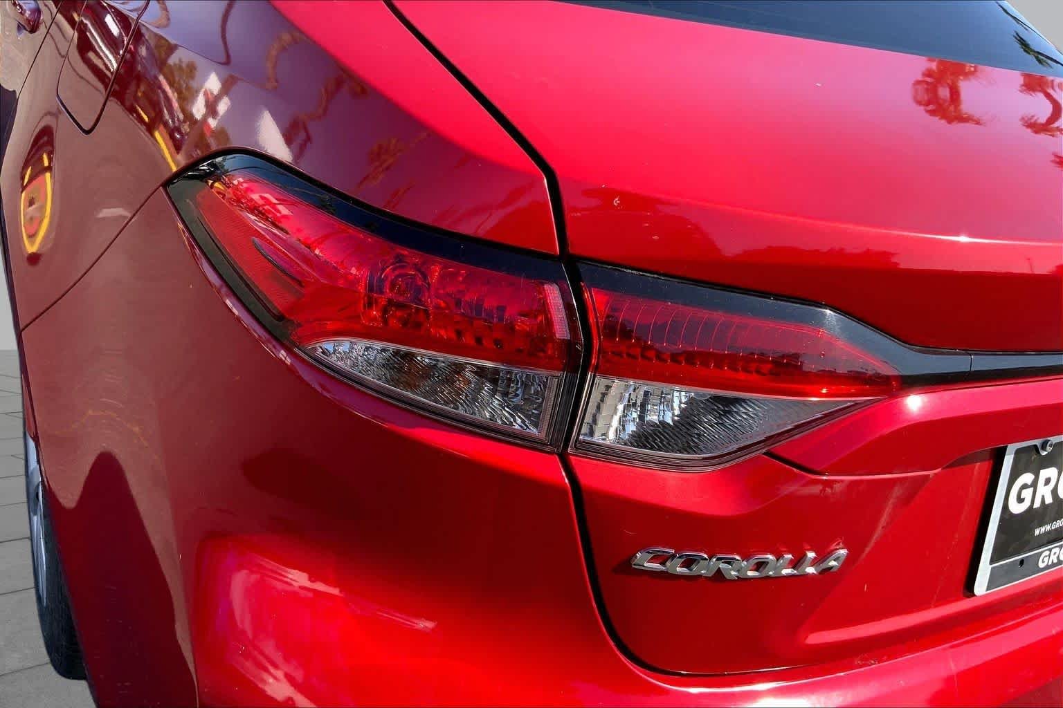 Used 2021 Barcelona Red Metallic Toyota LE image 28