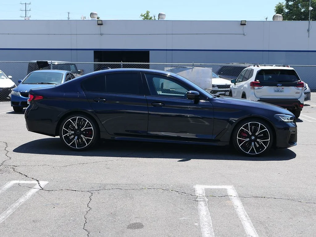Used 2023 Carbon Black Metallic BMW M550i xDrive image 3