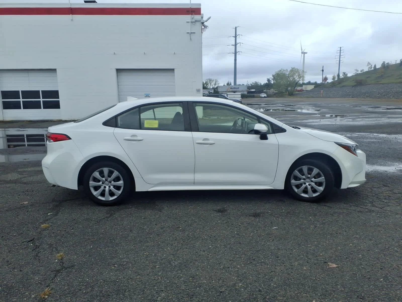 Used 2021 Super White Toyota LE image 4