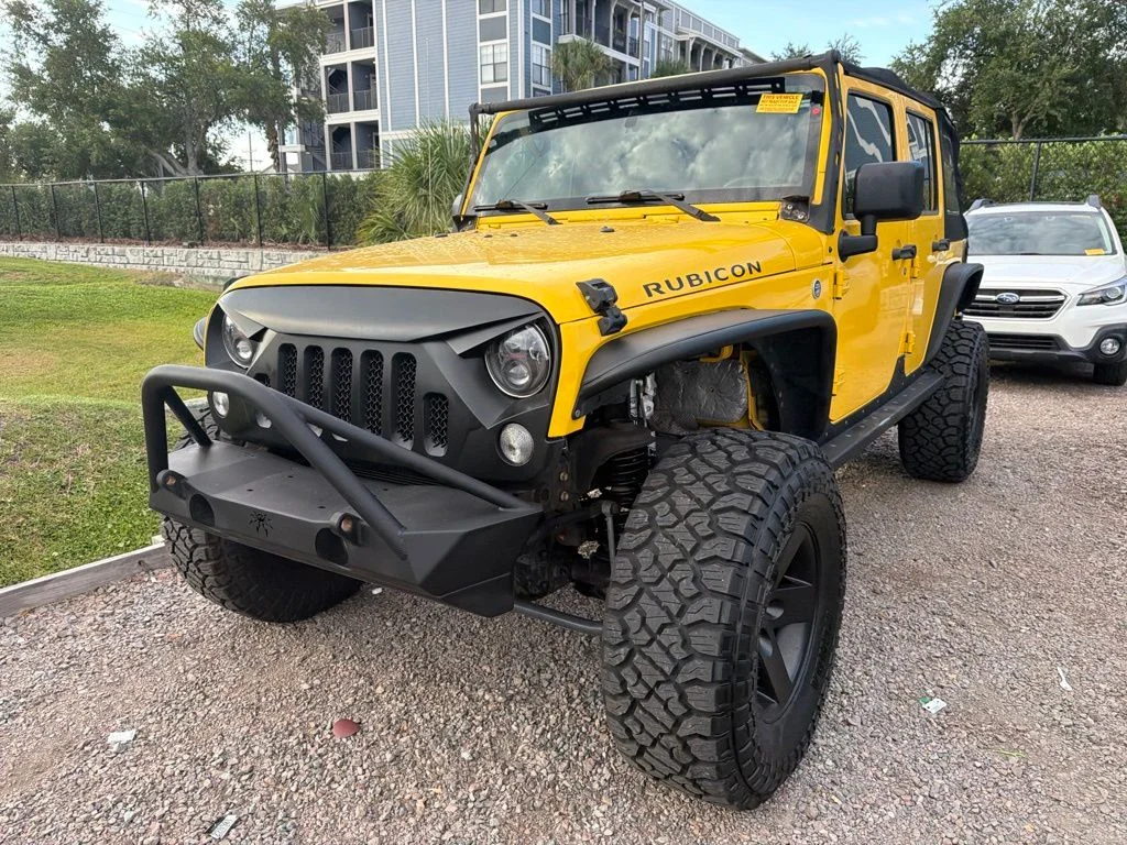 Used 2015 Yellow Jeep Unlimited Rubicon image 1
