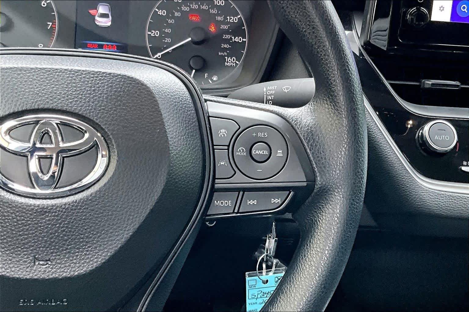 Used 2025 Midnight Black Metallic Toyota LE image 24