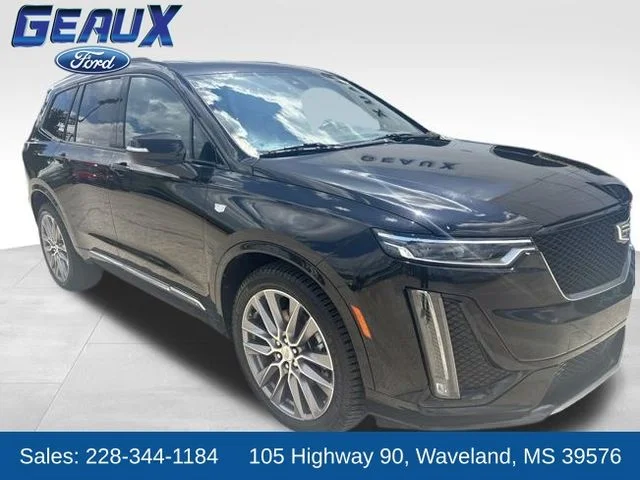 Certified Used 2021 Stellar Black Metallic Cadillac Sport image 1