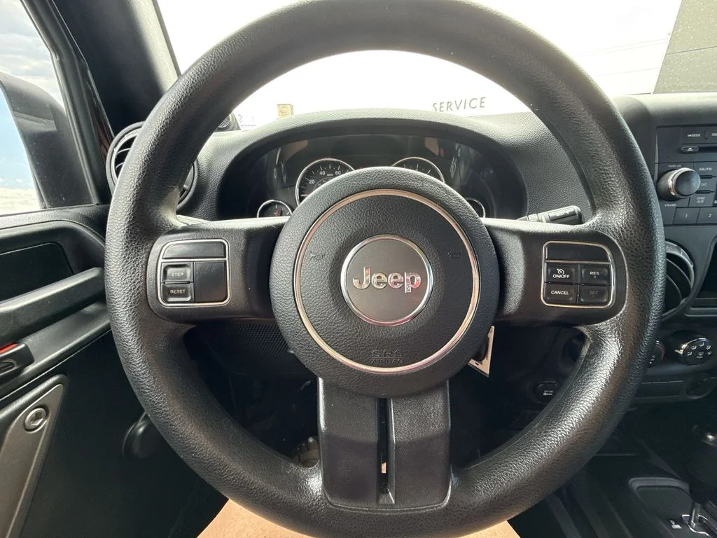 Used 2013 Black Jeep Unlimited Sport image 14