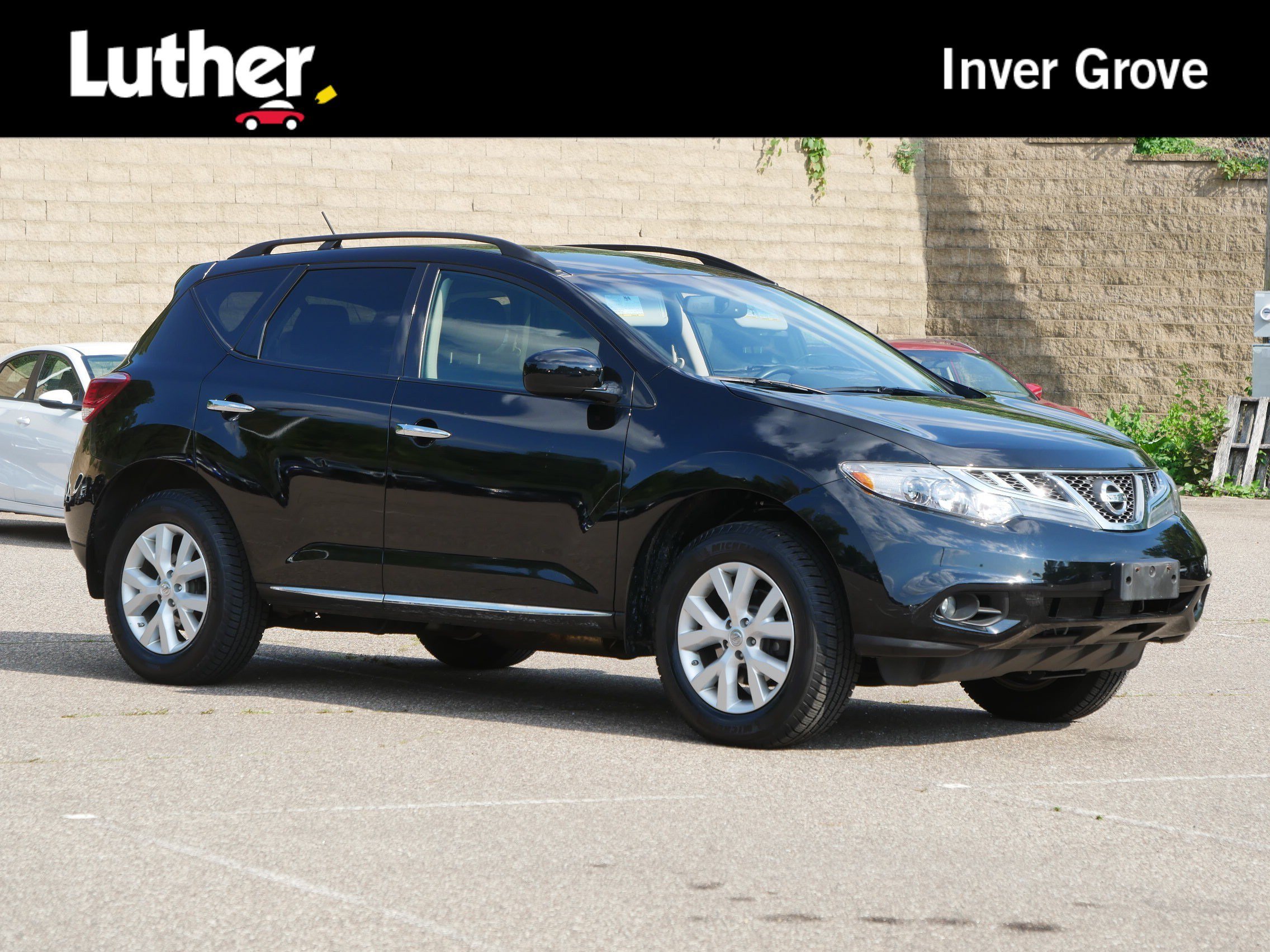 Used 2014 Super Black Nissan SV image 1