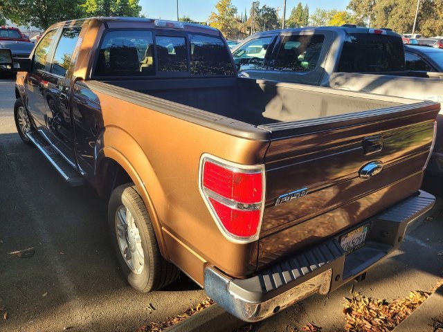 Used 2011 Gold Ford Lariat image 4