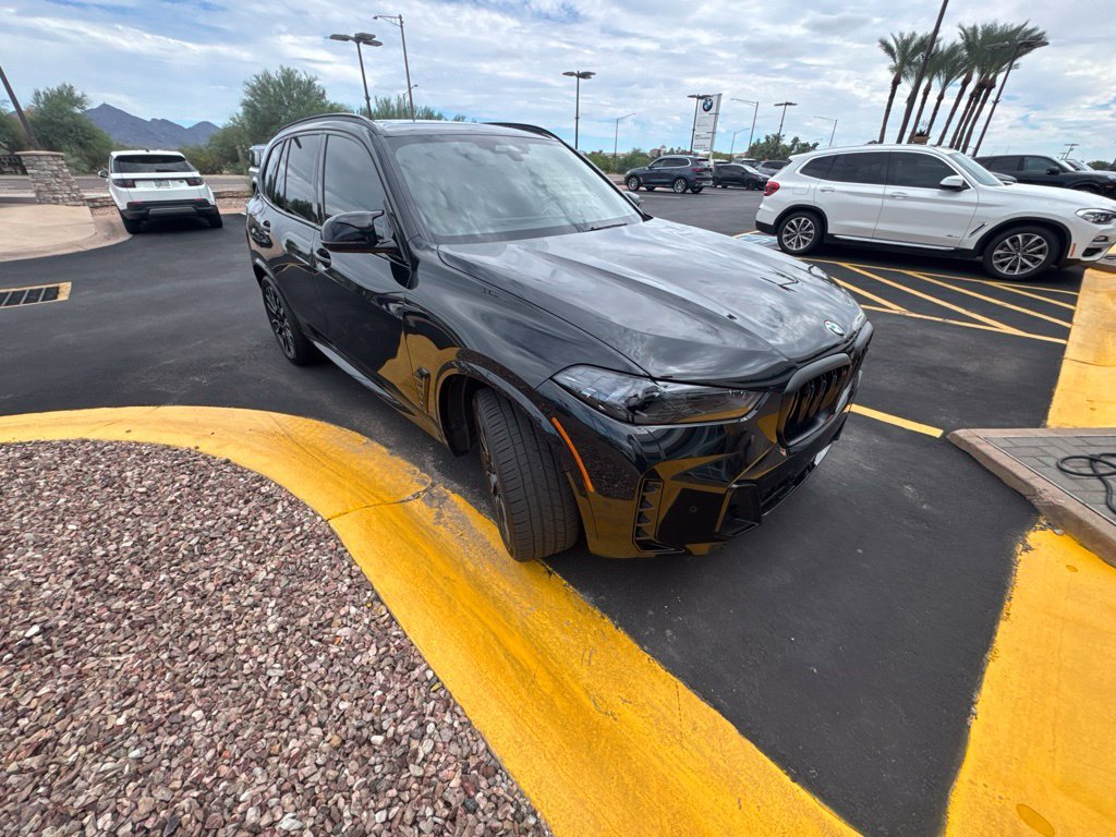 Certified Used 2026 Black Sapphire Metallic BMW M60i image 3