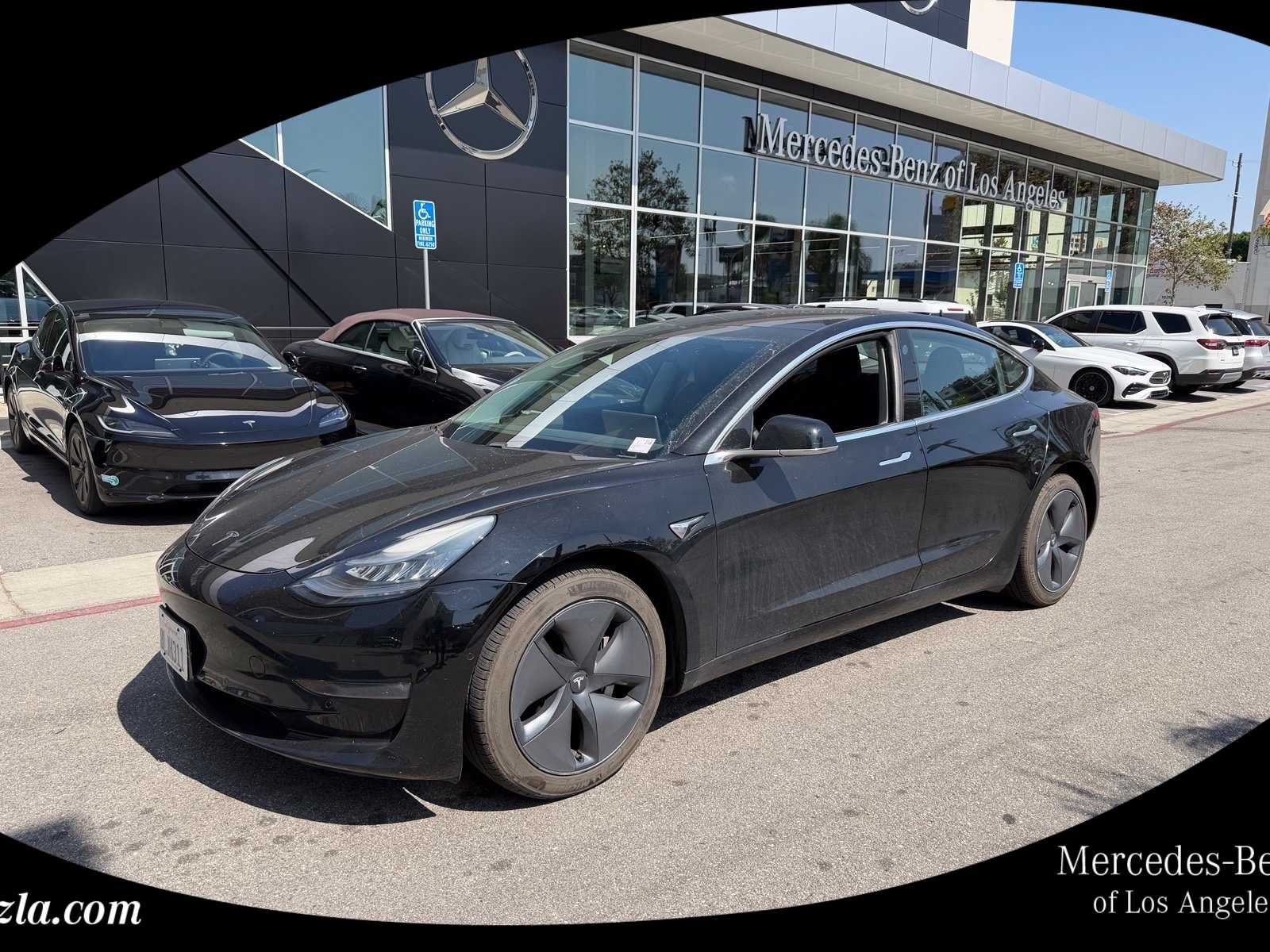 Used 2019 Solid Black Tesla Long Range image 1