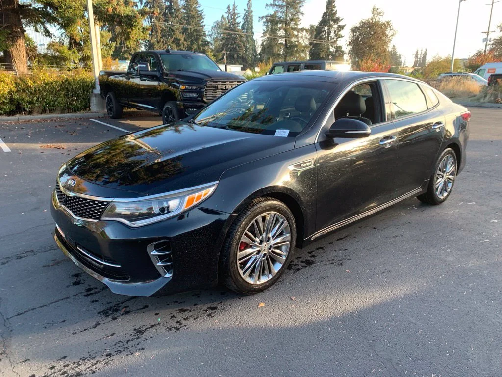 Used 2016 Ebony Black Kia SXL image 1