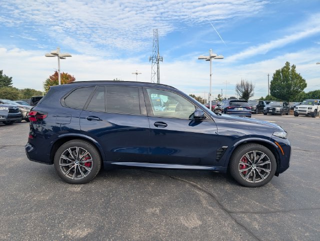 Certified Used 2026 Tanzanite Blue II Metallic BMW xDrive50e image 6