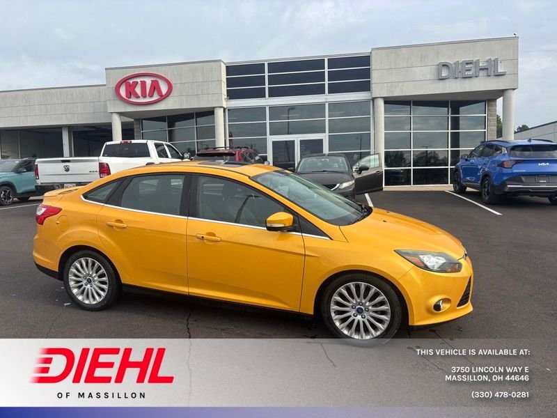 Used 2012 Yellow Ford Titanium image 1