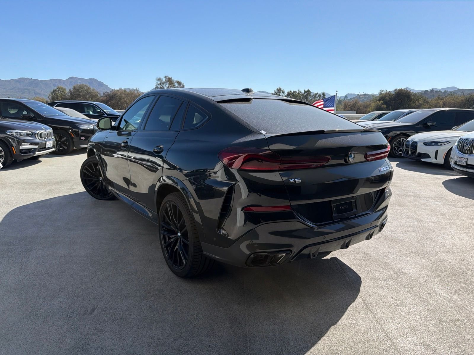 Used 2027 Black Sapphire Metallic BMW M60i image 2